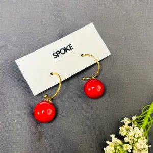 the intricate craftsmanship and striking color combination of our Golden Red Cherry Drop Earring. The golden finish adds a touch of opulence, while the red cherries lend a playful and whimsical charm. These earrings are a true statement piece that will make you stand out from the crowd.