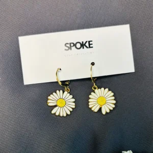 The delicate white petals and golden center create a harmonious contrast that catches the light and adds a subtle shimmer to your ensemble. This earring is made from high-quality materials, ensuring durability and long-lasting beauty.